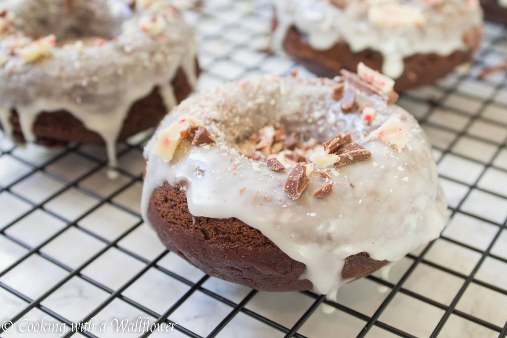 Glazed Chocolate Cake Doughnuts with Peppermint Bark | Cooking with a Wallflower